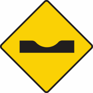 Sharp depression or dip ahead.