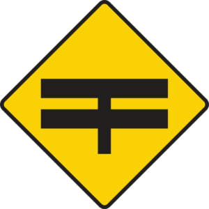 T-junction with dual carriageway ahead.