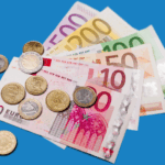 A pile of euro notes and coins.